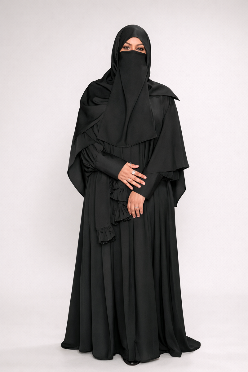 modest black abaya set with pearl accented shayla
luxury black abaya with high low cape and niqab